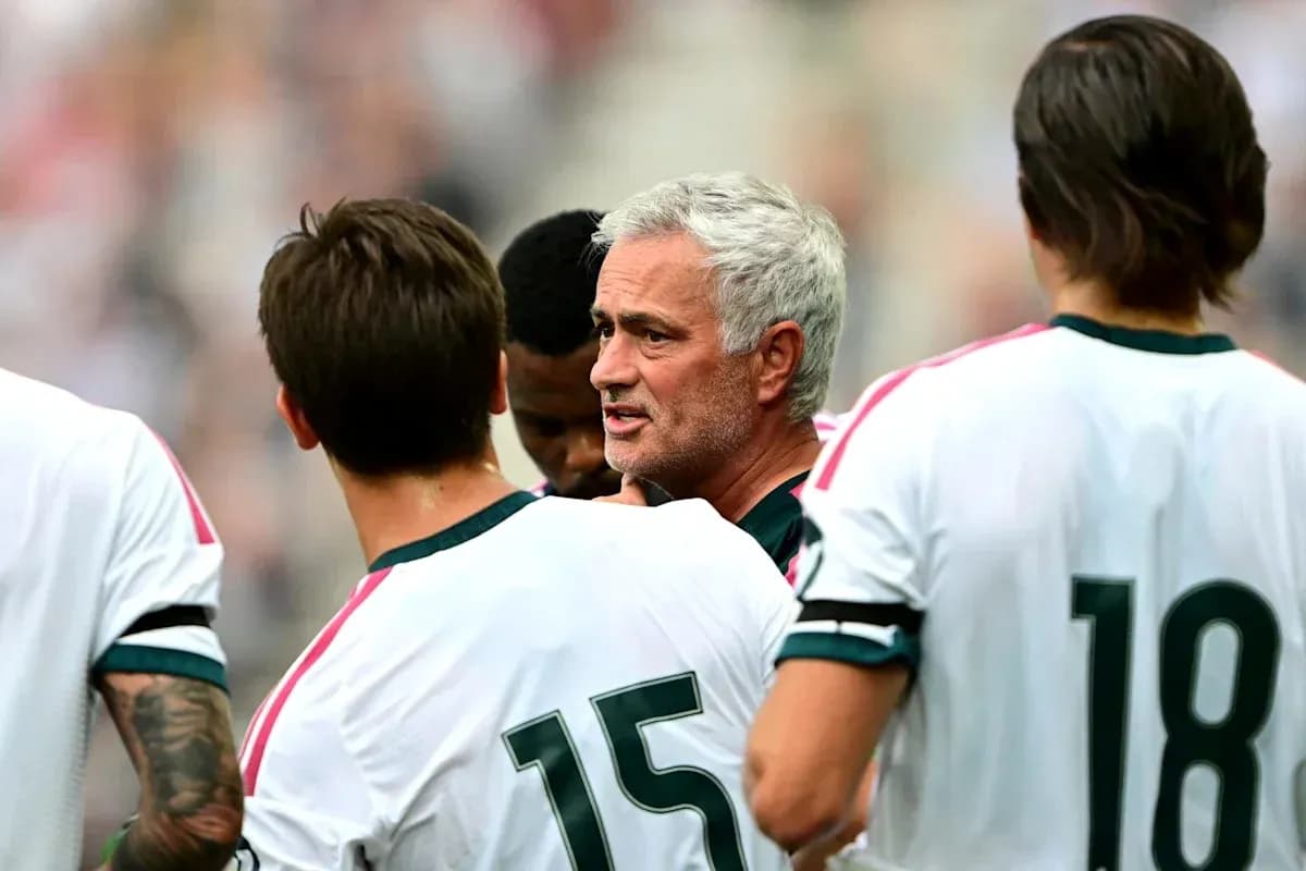 Coach speaking to players during a team huddle