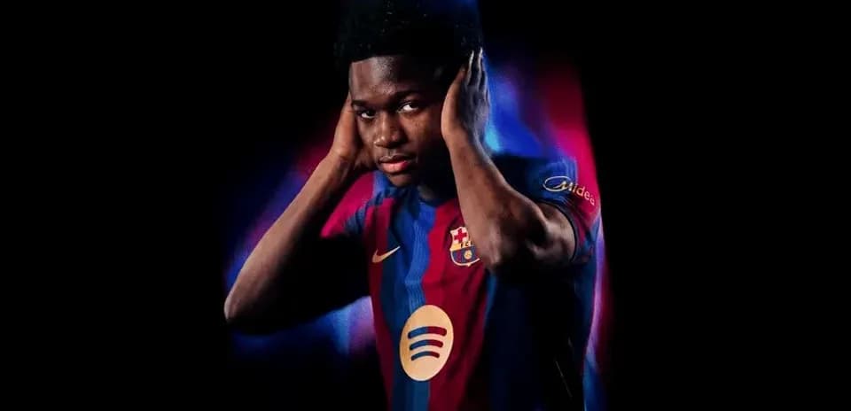 Player wearing Barcelona jersey with colorful background