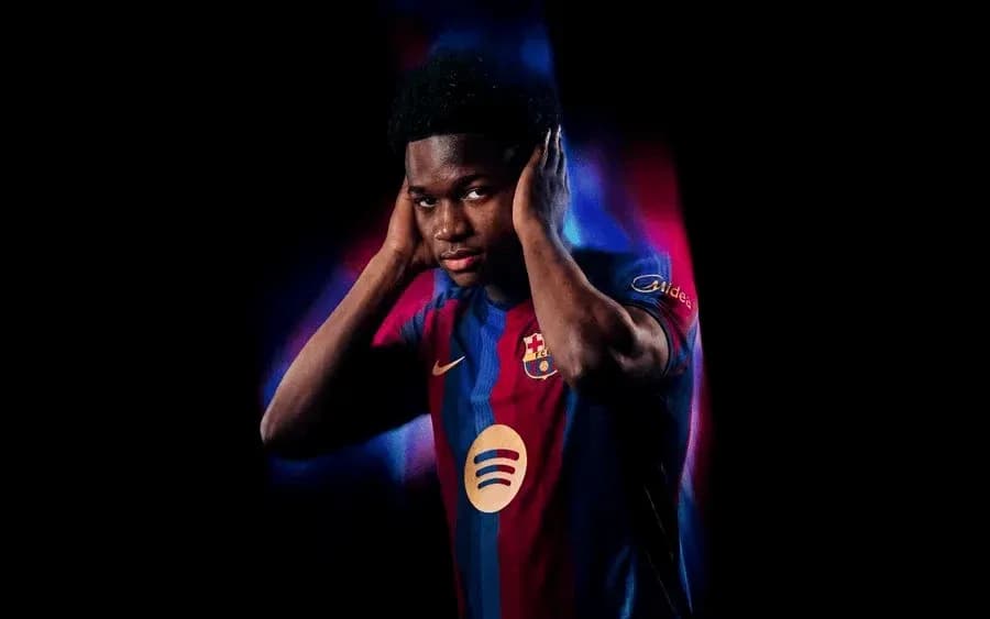 Player wearing Barcelona jersey with colorful background
