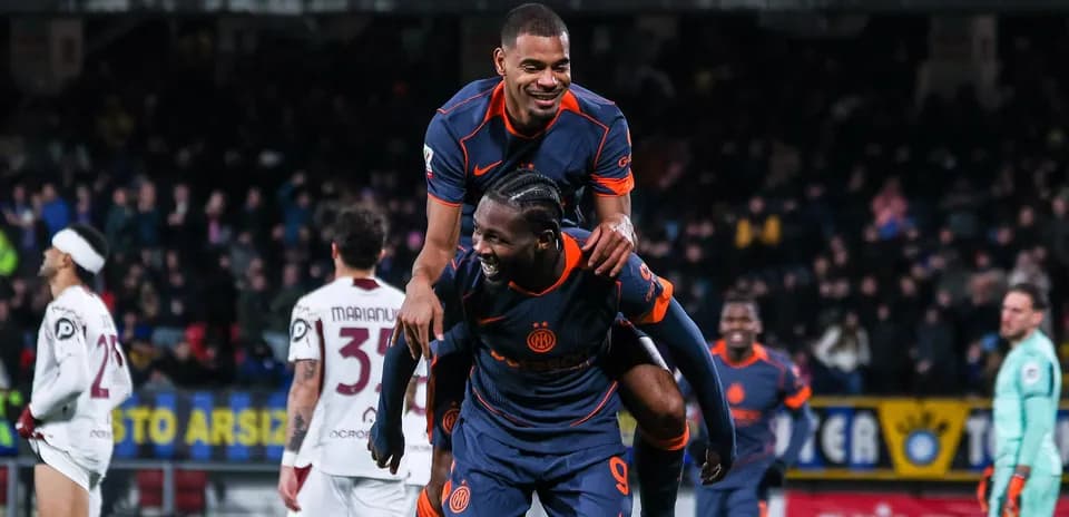Players celebrating with a piggyback during match