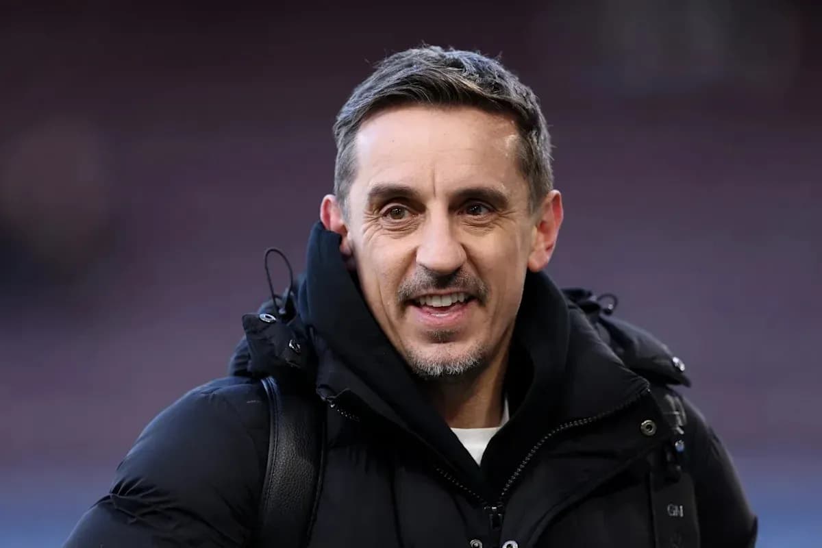 Man smiling in a black jacket outdoors