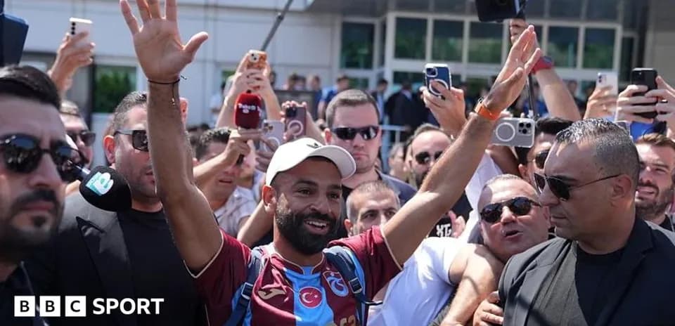 Player greeting fans outside the stadium