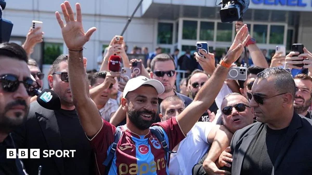 Player greeting fans outside the stadium