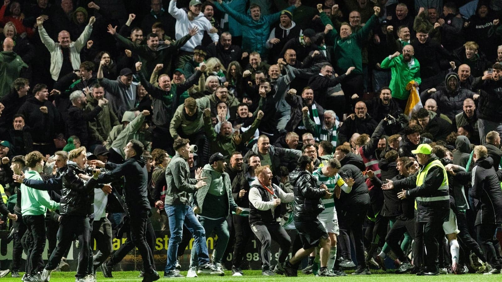 Crowd celebrating during a football match