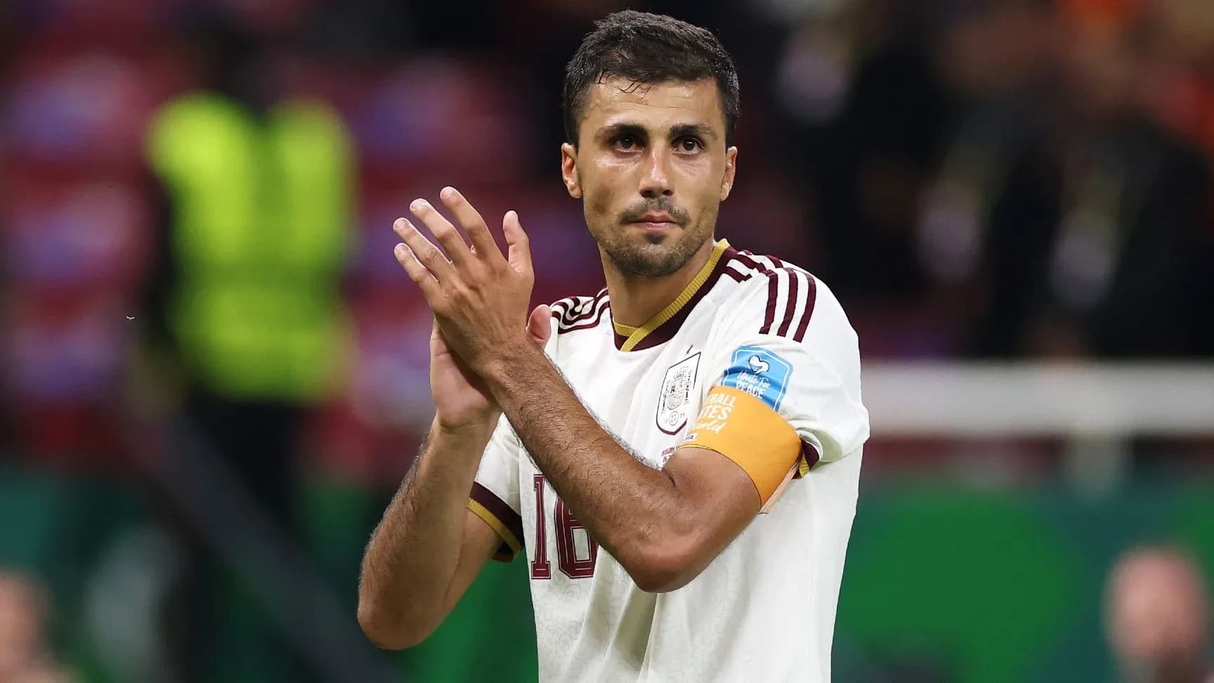 Player applauding fans after a match