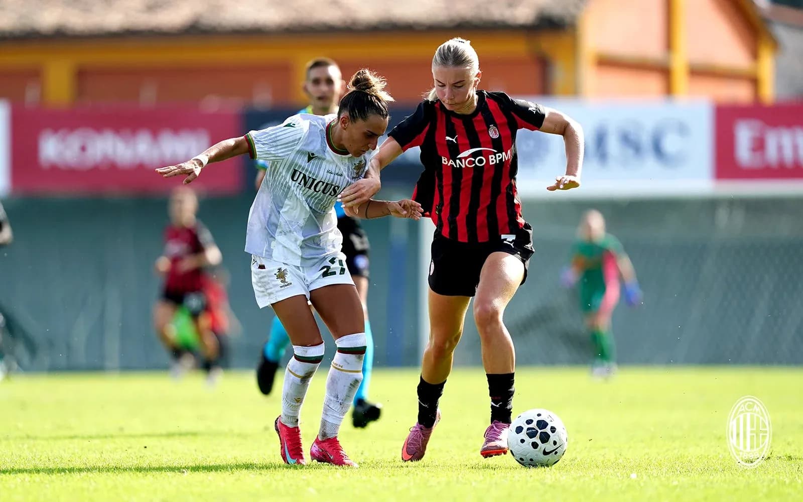 Players competing for the ball during match
