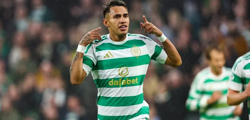 Player celebrating goal in Celtic kit during match