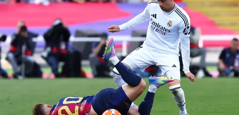 Player tackling opponent during Barcelona vs Real Madrid