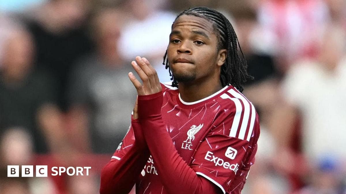 Player in Liverpool kit applauding the crowd