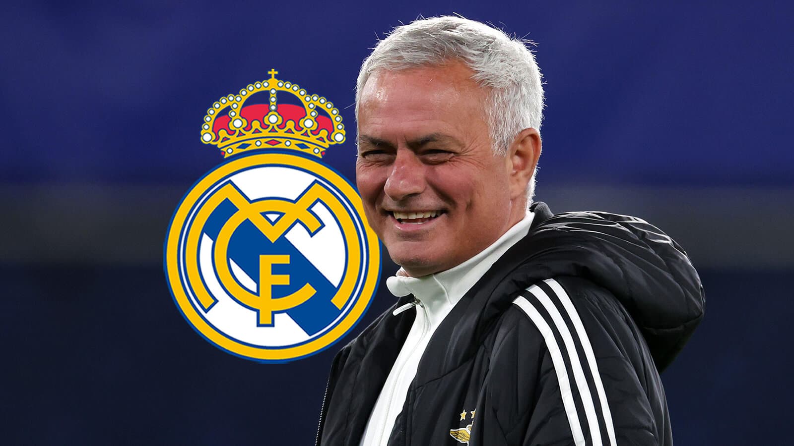 Coach smiling with Real Madrid logo in background