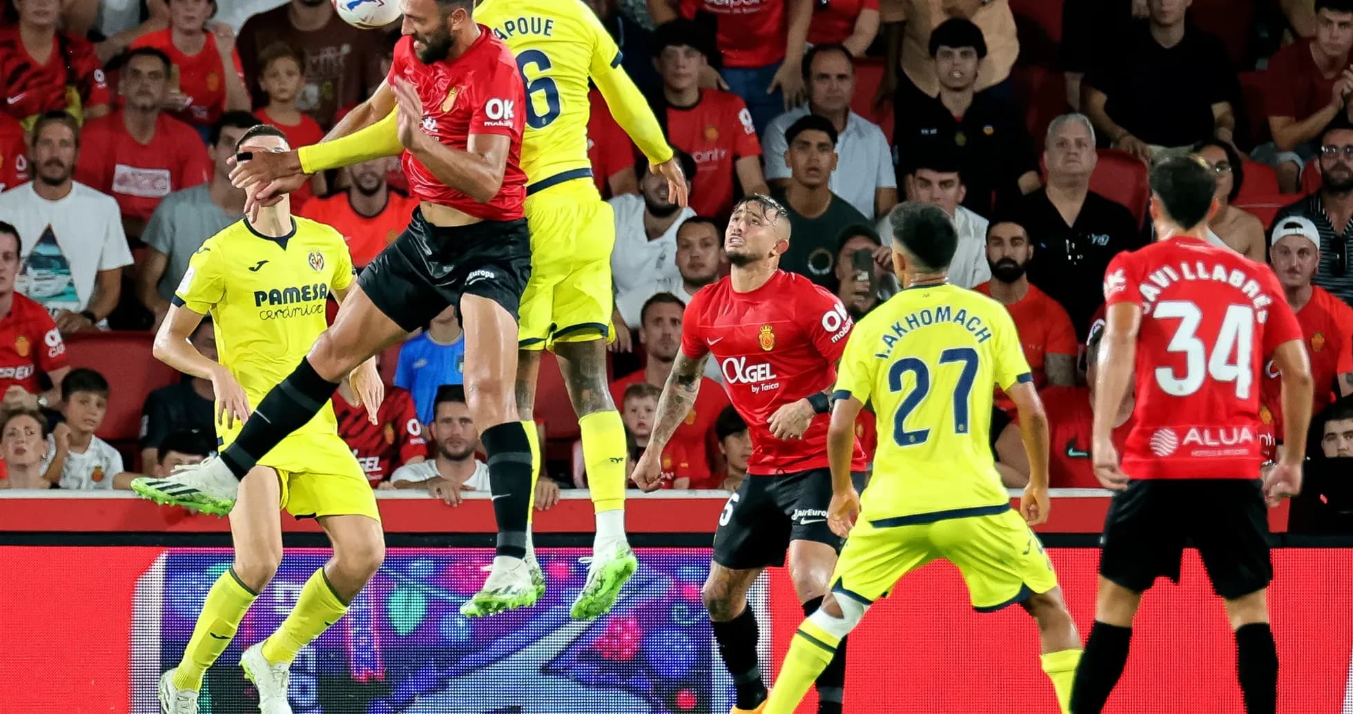 Players contesting a high ball during match