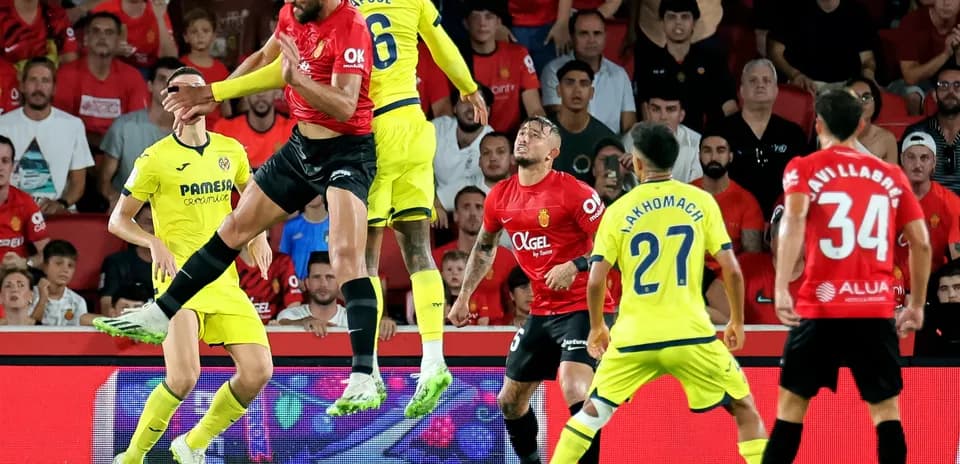 Players contesting a high ball during match