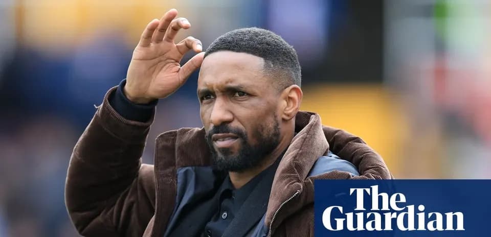 Coach gesturing during a football match
