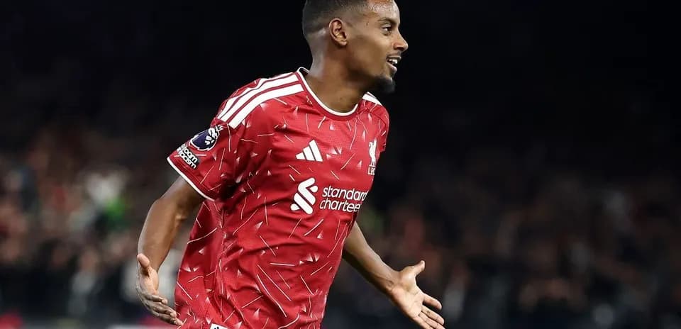 Player celebrating goal in red Liverpool jersey