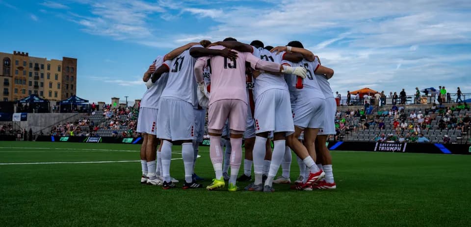 Greenville Triumph players huddling before match