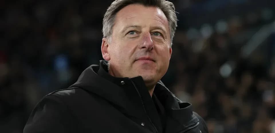 Coach observing the match from the sidelines