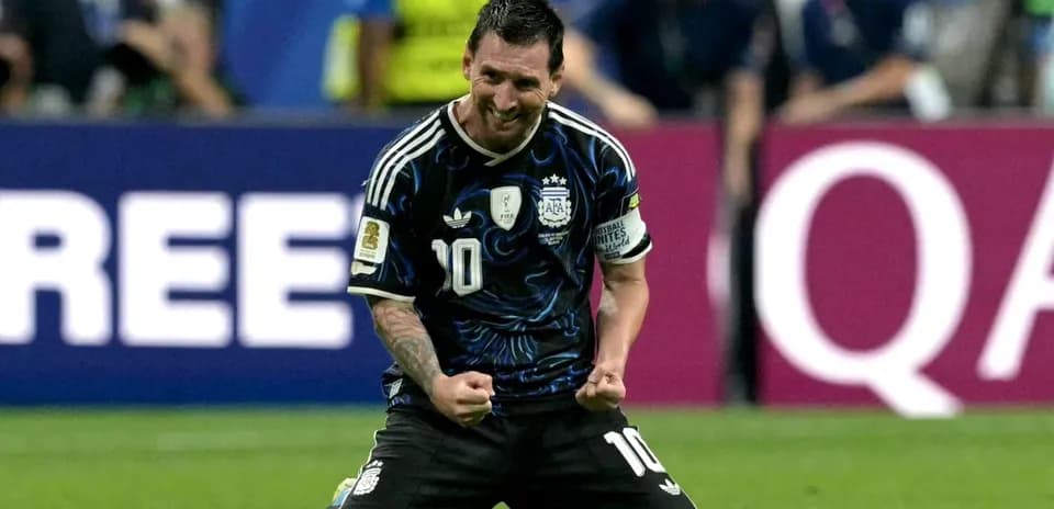 Lionel Messi celebrating on the pitch after match