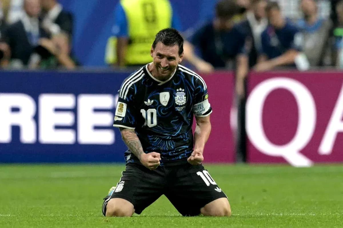 Lionel Messi celebrating on the pitch after match Lionel Messi celebrating on the pitch after match