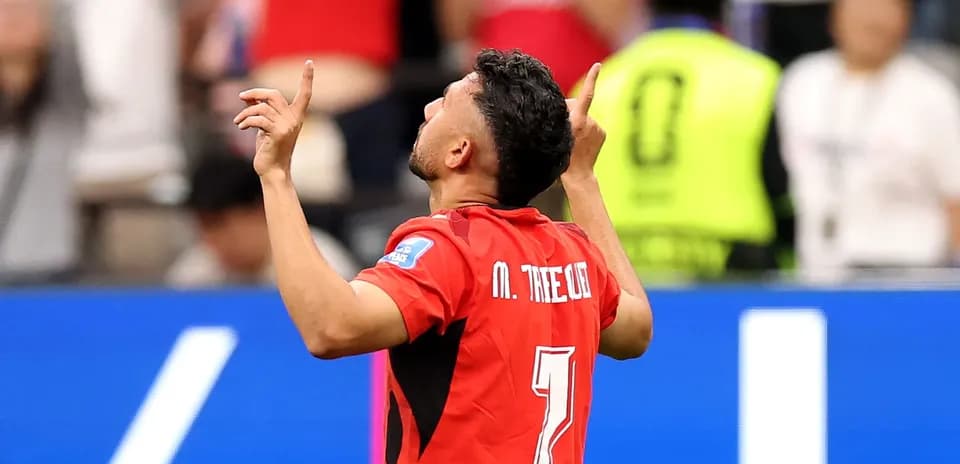 Player celebrating after scoring a goal in match