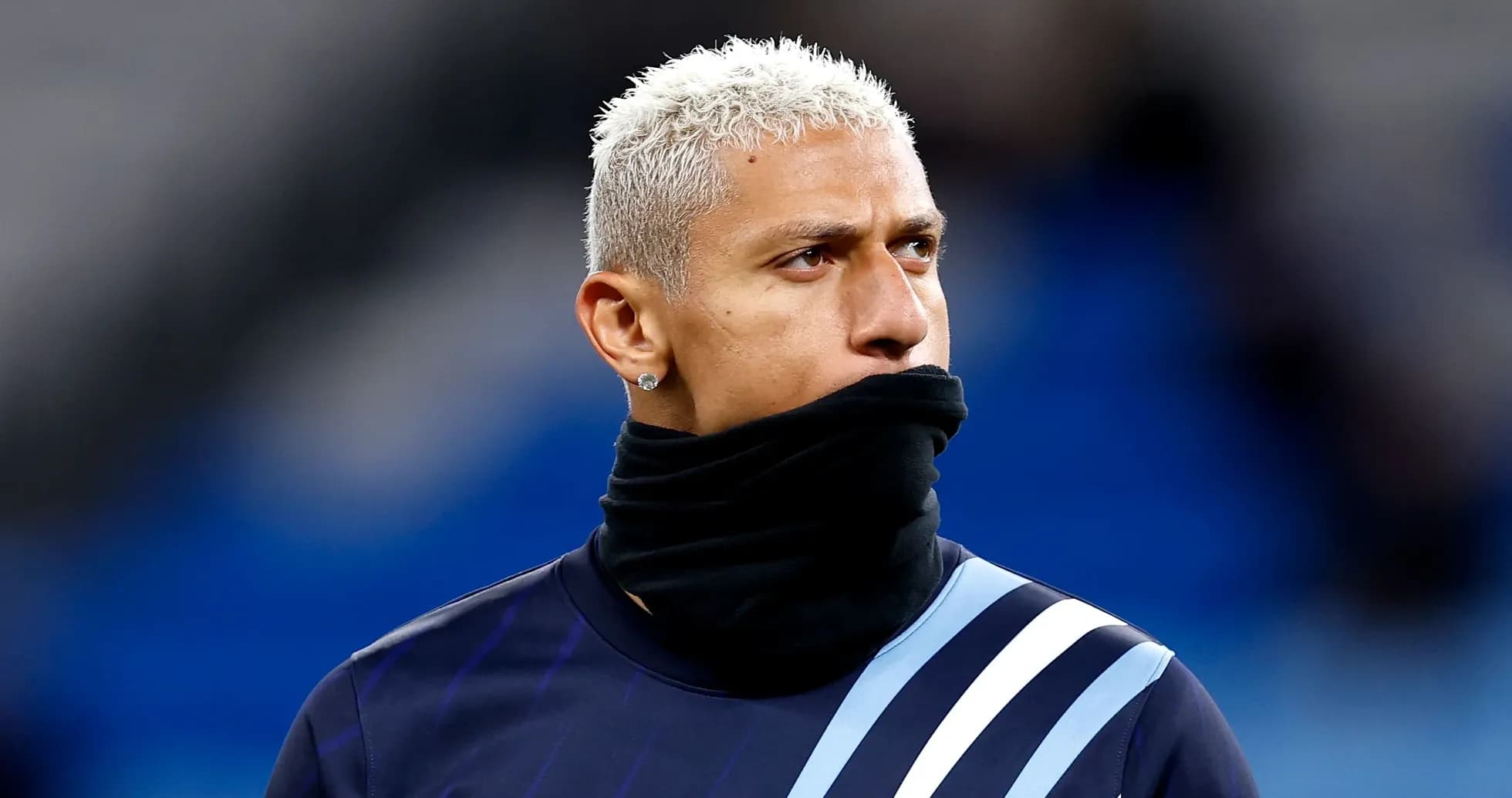 Player wearing a black scarf during warm-up