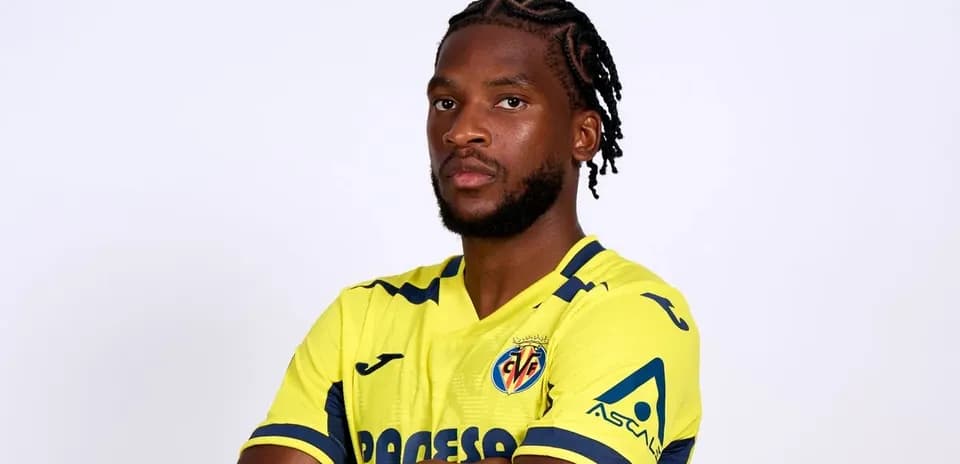 Player in yellow Villarreal jersey posing confidently