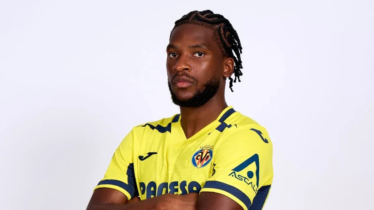 Player in yellow Villarreal jersey posing confidently