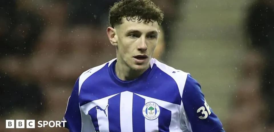 Wigan Athletic player in blue and white jersey