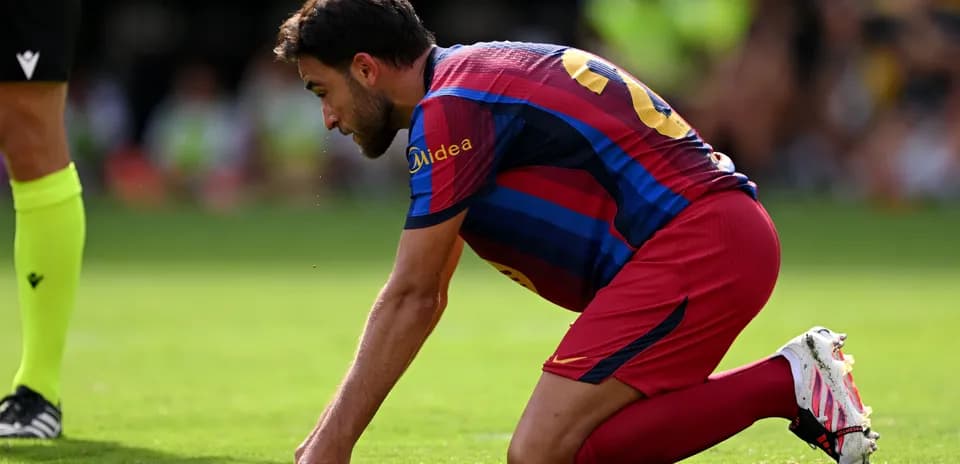 Player on knees on field during match