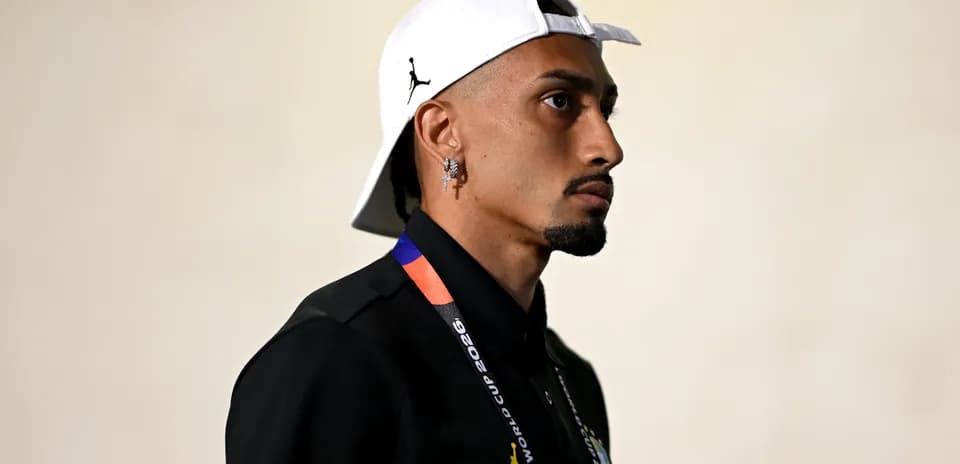 Person wearing a cap and FIFA World Cup lanyard