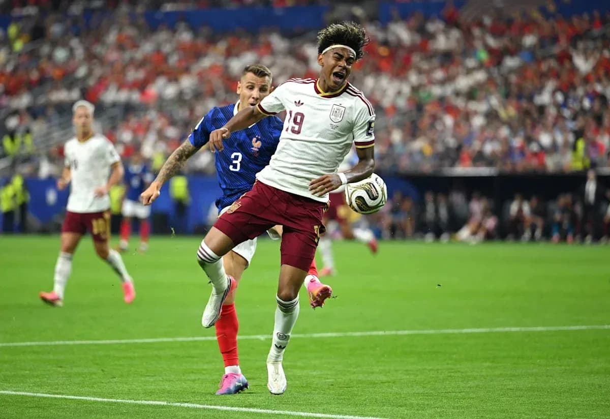 Player from Spain evading a tackle from France