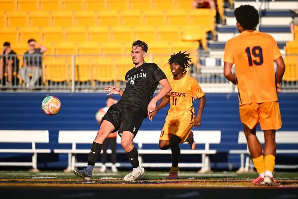 Player passing the ball during soccer match