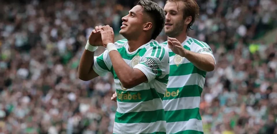 Celtic players celebrating a goal on the pitch