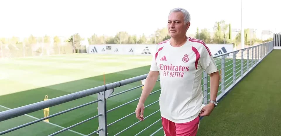 Coach walking on training ground at facility