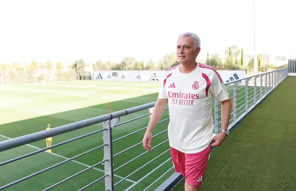 Coach walking on training ground at facility