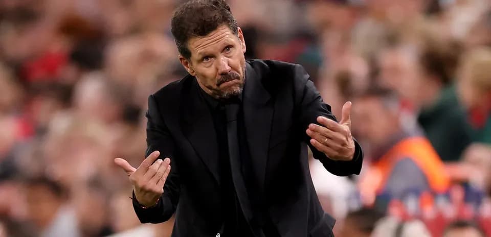 Coach gesturing during a match on the sidelines