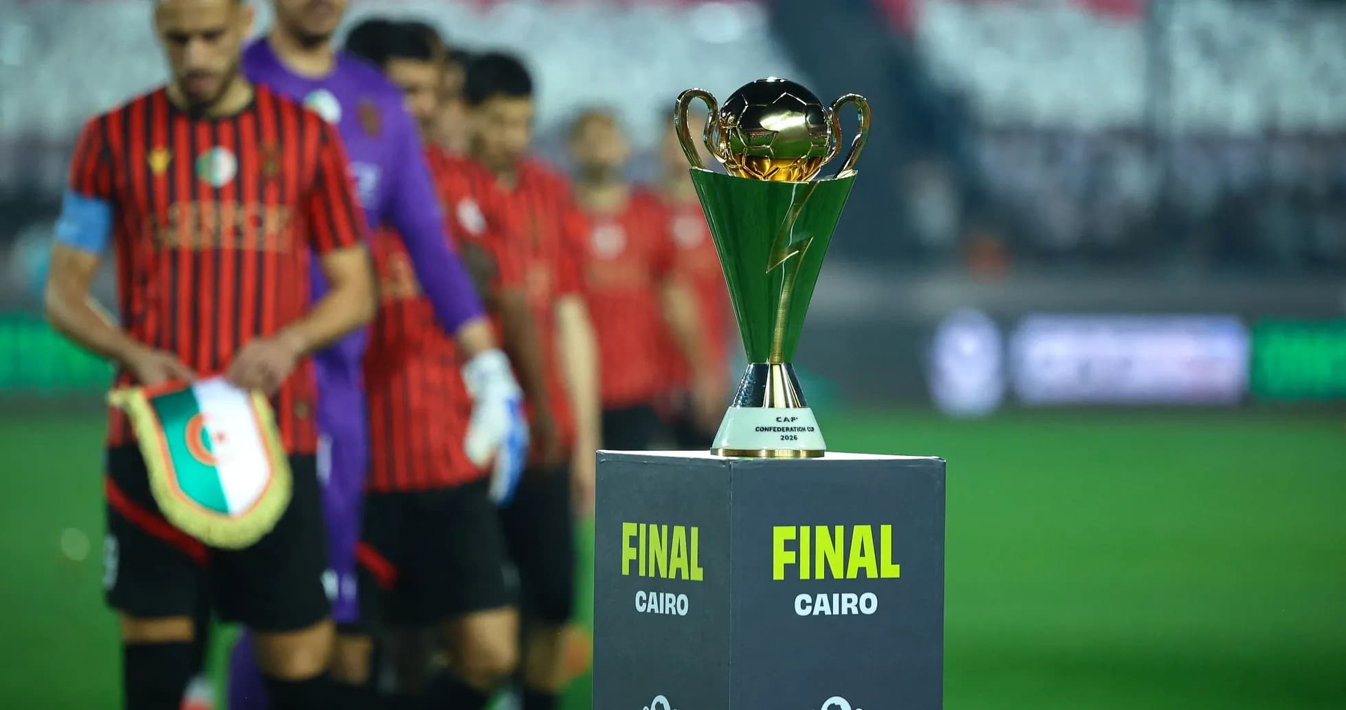Players entering field with trophy for final match