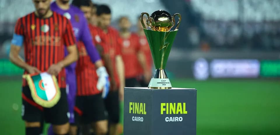 Players entering field with trophy for final match
