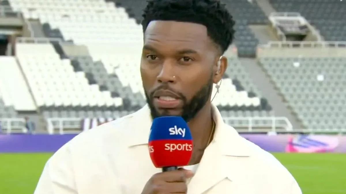 Presenter speaking into microphone at stadium