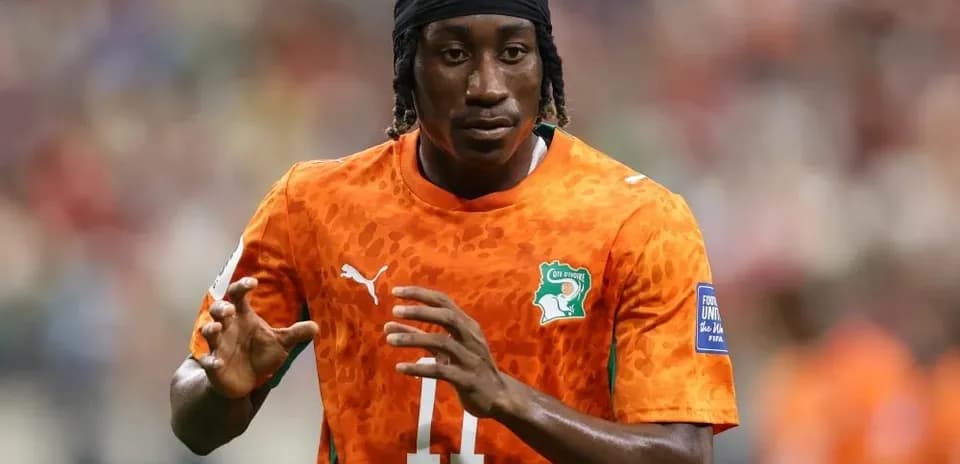 Player in orange jersey preparing for match