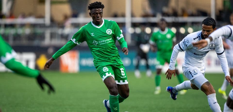 Player dribbling the ball in USL match