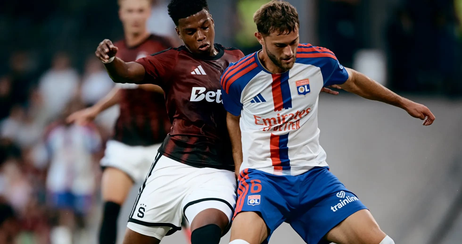 Lyon player competing for the ball against Sparta Praha