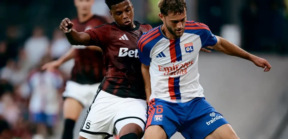 Lyon player competing for the ball against Sparta Praha