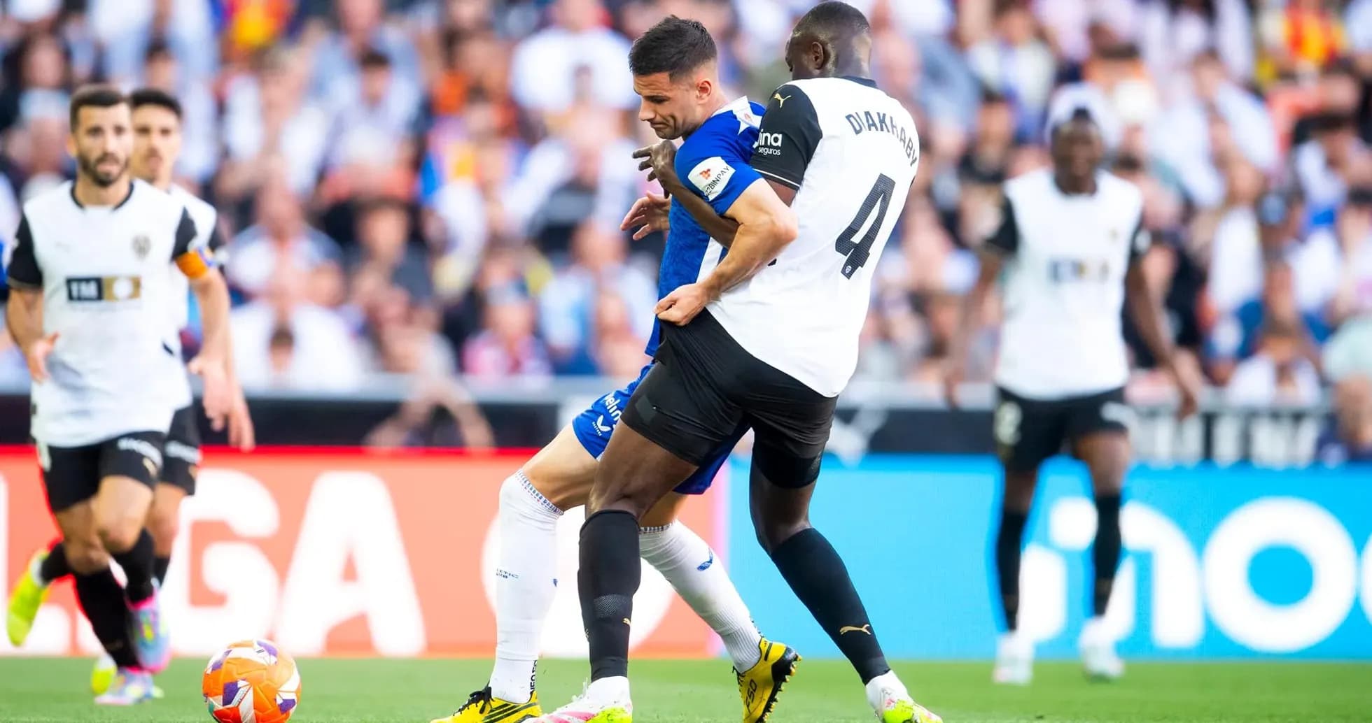 Players competing for the ball in La Liga match