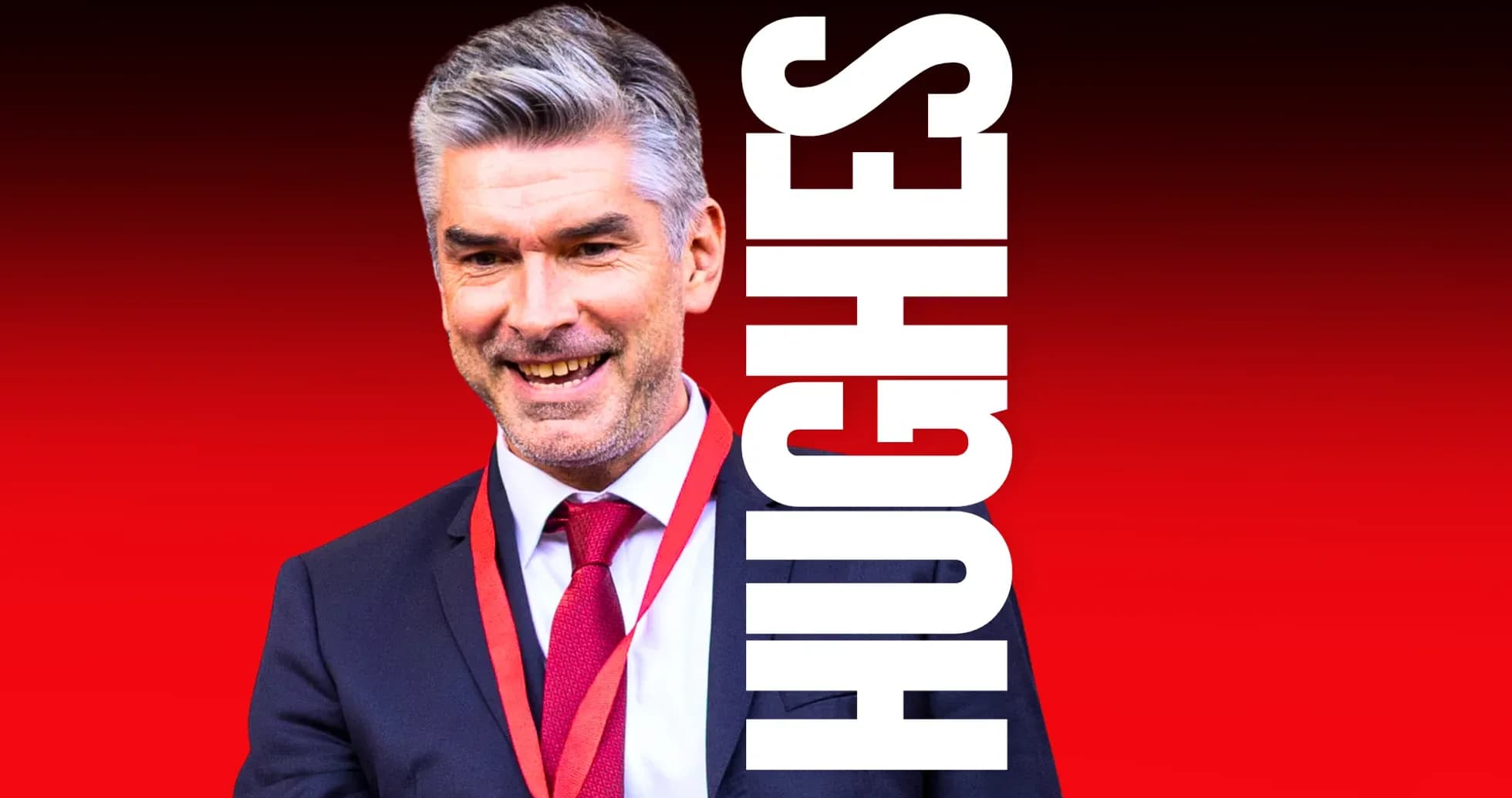 Man in suit smiling with red background
