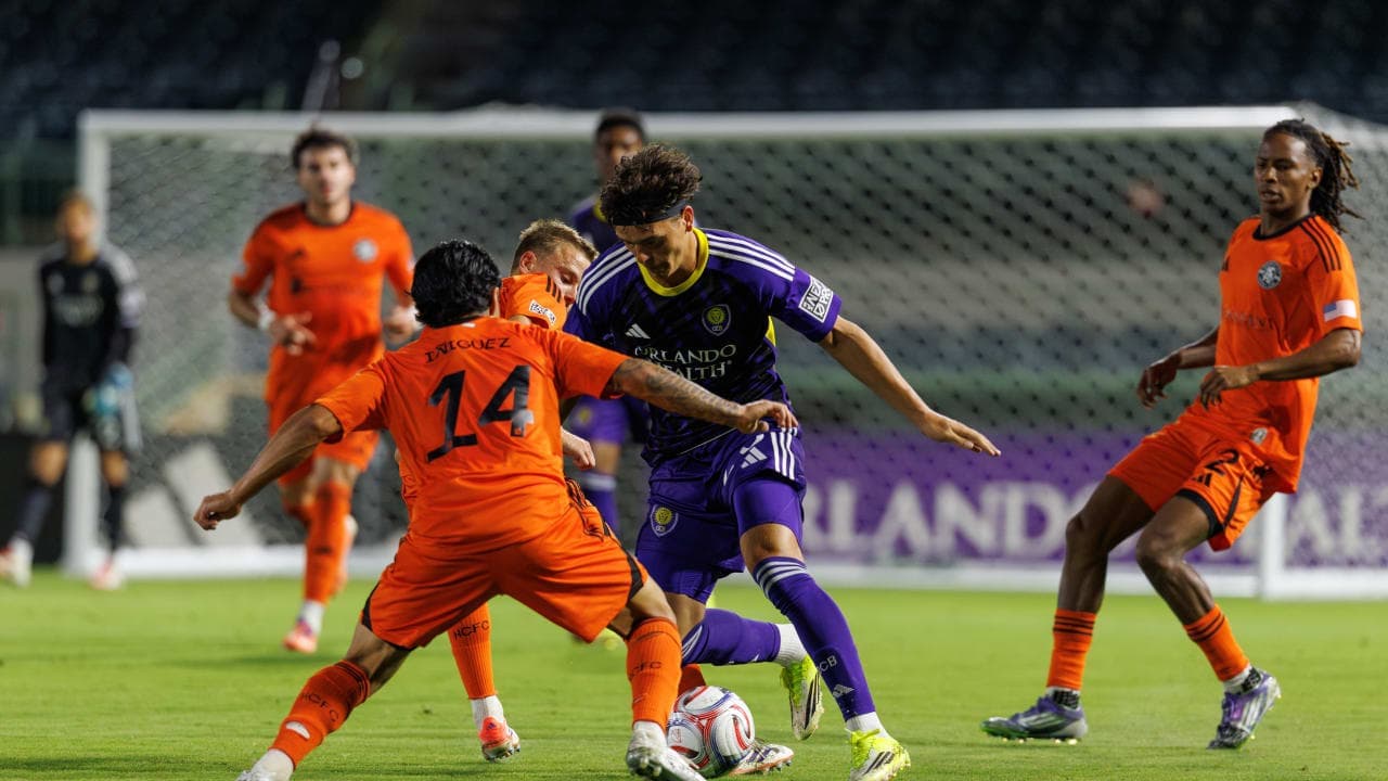 Players competing for the ball during match