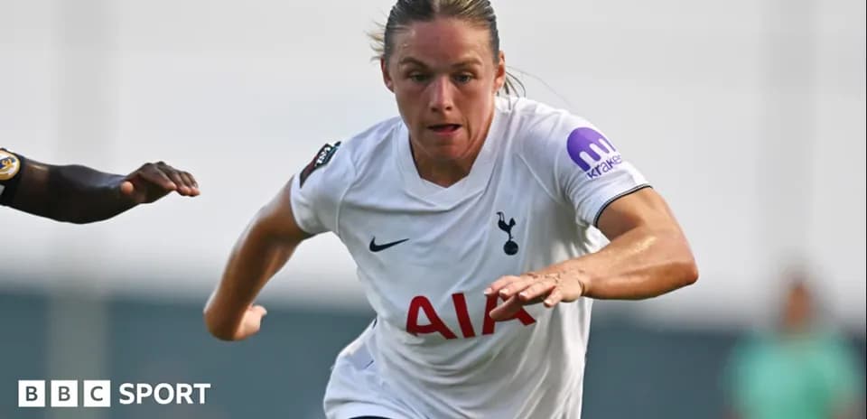 Player running with ball during match for Tottenham