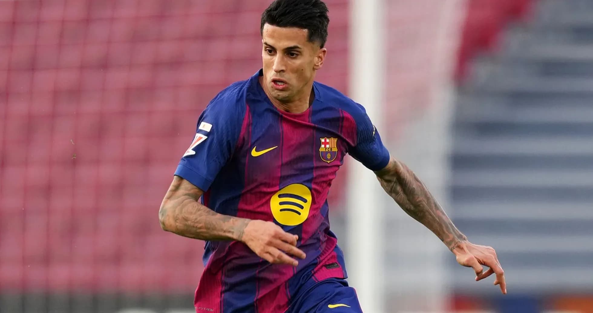 Player in Barcelona kit running on the field