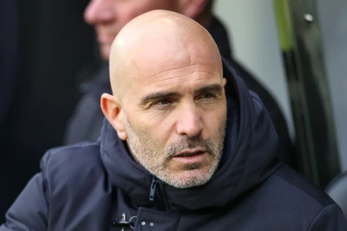 Coach observing from the sidelines during a match