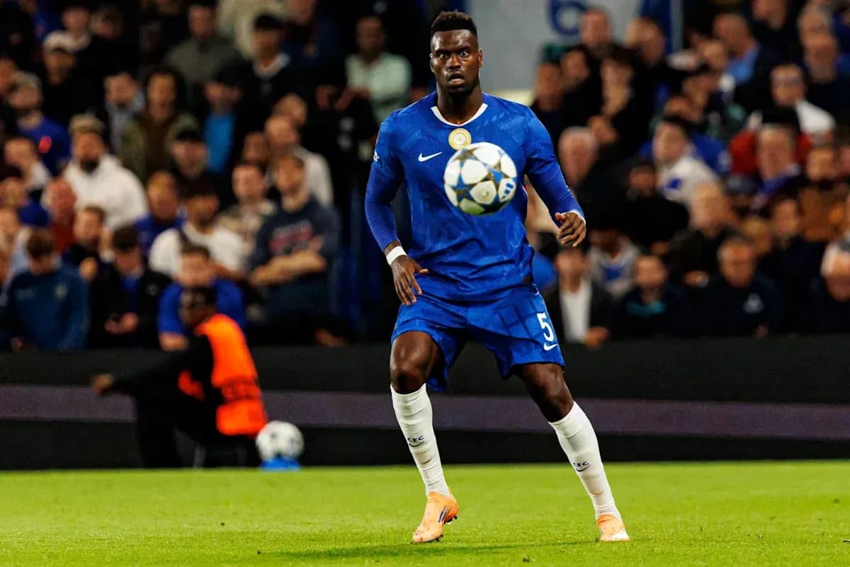 Player in blue kit controlling ball during match