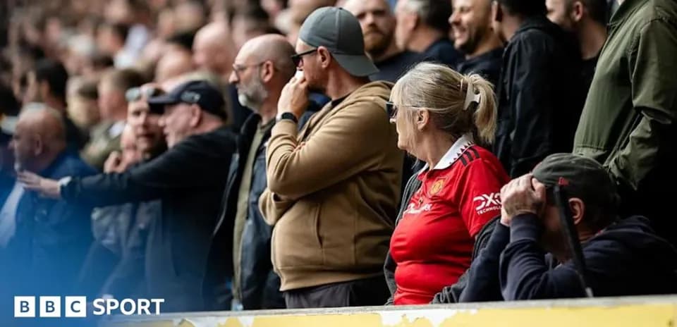 Fans watching the match from the stands